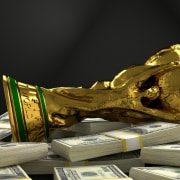 football world cup on a pile of money