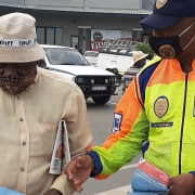 A JMPD officer talking to a member of the public