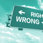 Sign pointing to wrong way or right way