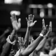 Photo of hands raised in the air