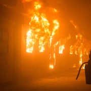 Photo of a man running to put out a train on fire